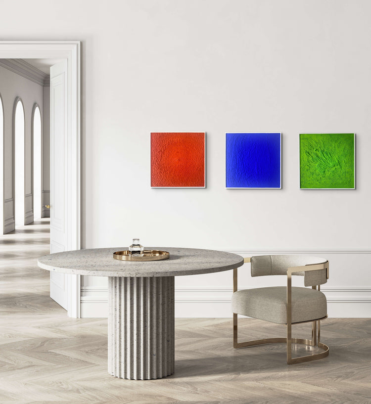 Collection of 3 monochrome abstract artworks in a room, Orange, Yves Klein blue and green